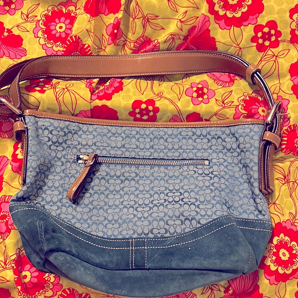 This is a small signature Coach bag.